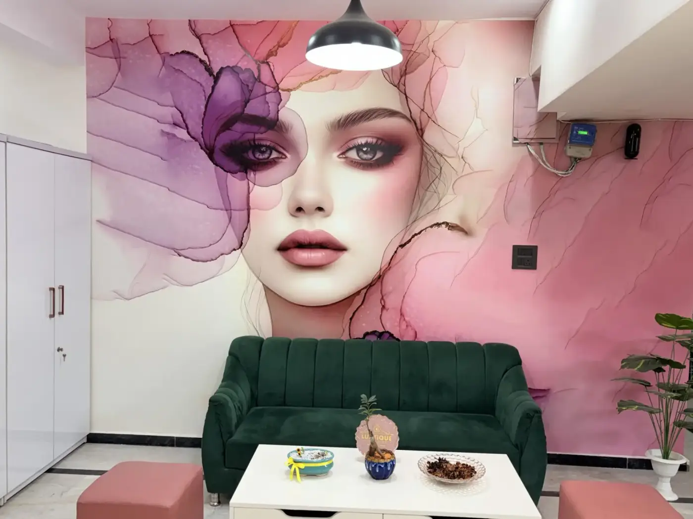 Reception lounge with hand-painted feminine mural at Luxtique Academy