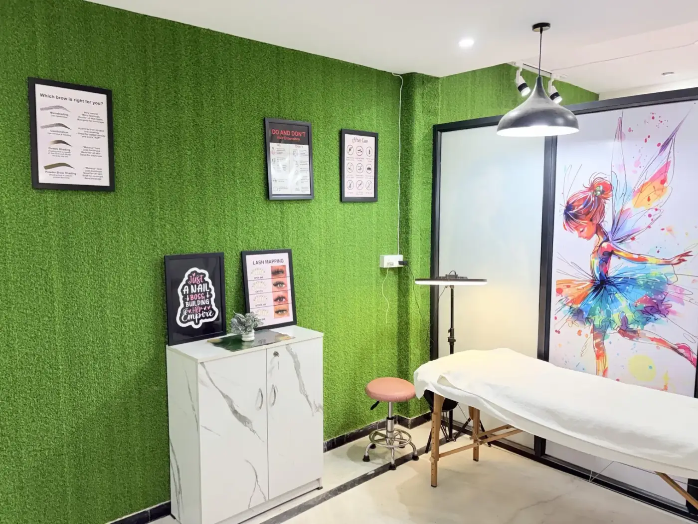 Microblading treatment room with curated framed art
